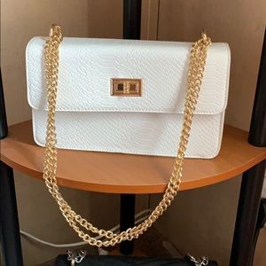 White clutch with golden chain strap